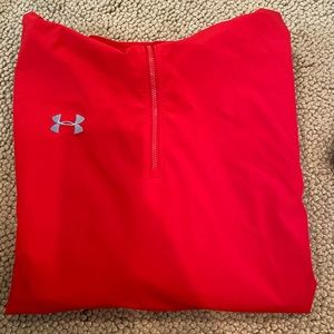 A red Under Armour hooded quarter zip
